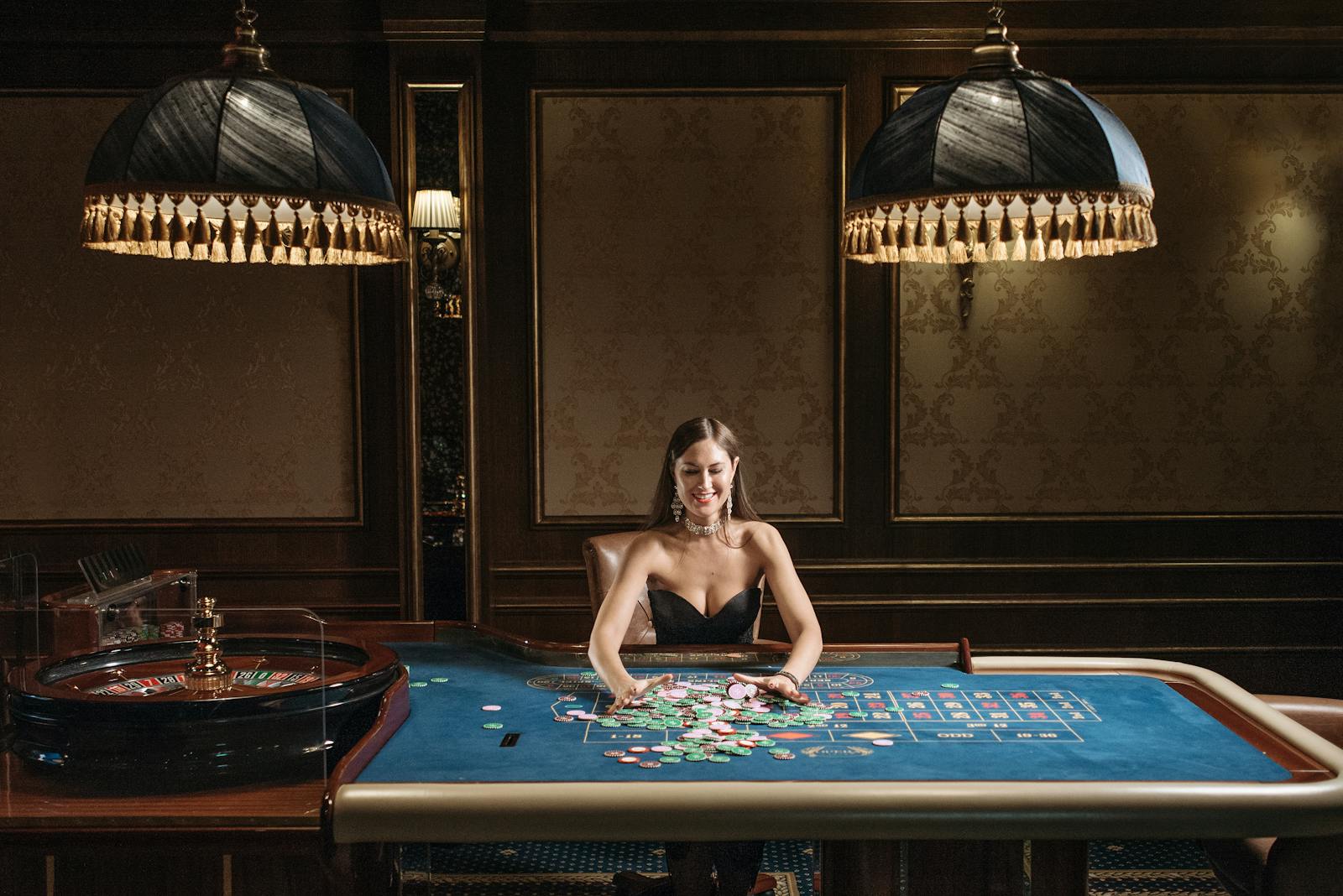 A glamorous woman enjoying a game of roulette at a luxurious casino table.